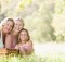 Grandmother with adult daughter and grandchild on picnic